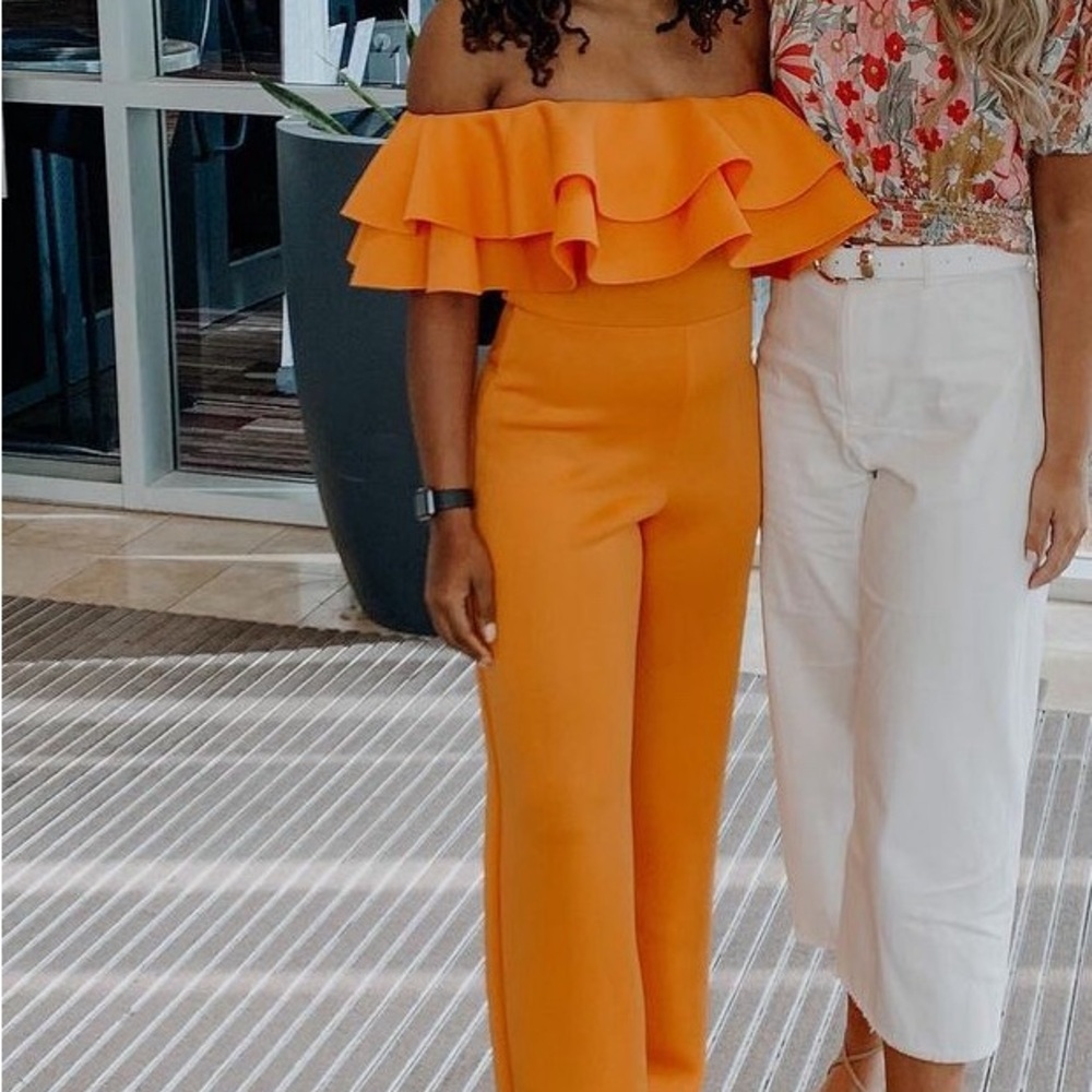 Bold Orange Wide-Leg Jumpsuit with Ruffled Off-Shoulder Design
